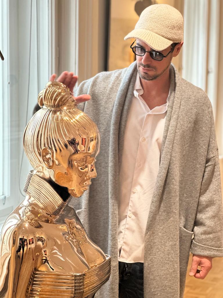 Philippe Shangti with his sculptures